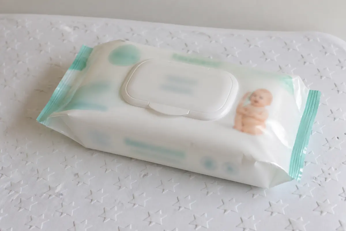 A pack of unscented baby wipes on a changing mat, no cream in frame