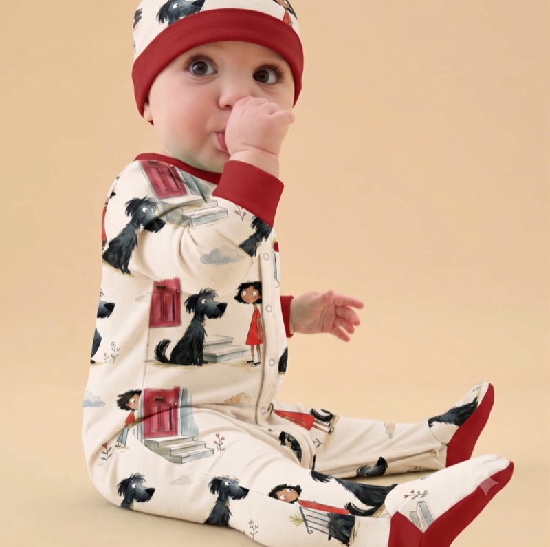 Baby wearing organic sage zip sleepsuit